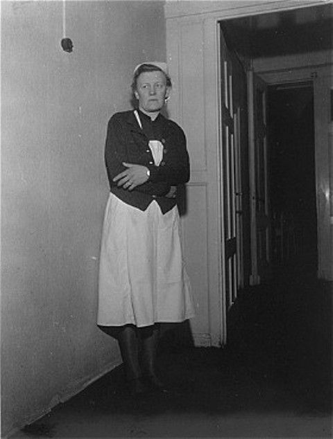 Irmgard Huber, chief nurse at Hadamar Institute, poses in the corridor of the euthanasia facility