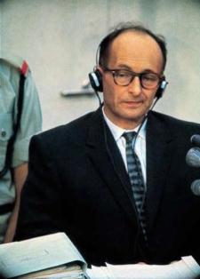 Adolf Eichmann listens to witness testimony