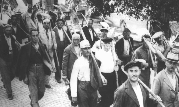 images/Jews drafted into the Hungarian Labor Service System march to a work site. Szeged, Hungary, between 1940 and 1944